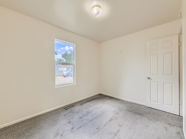 1850 W 50th Ave, Denver, CO 80221 - carpeted empty room featuring baseboards