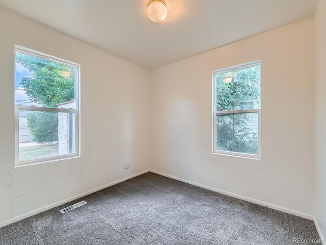 1850 W 50th Ave, Denver, CO 80221 - empty room featuring dark colored carpet