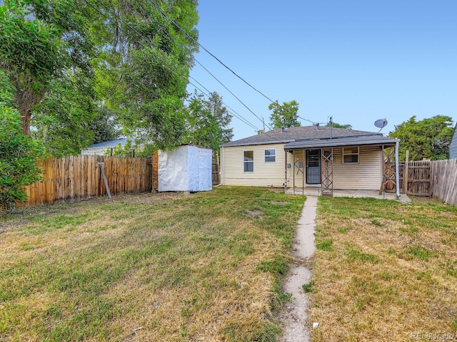 1850 W 50th Ave, Denver, CO 80221 - back of property with a fenced backyard, a shed, and a patio