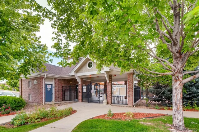 16320 E Fremont Ave Unit 1, Aurora, CO 80016 - view of building exterior featuring a fenced front yard