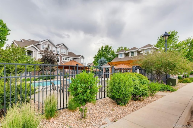 16320 E Fremont Ave Unit 1, Aurora, CO 80016 - view of property's community with fence, a pool, and a residential view