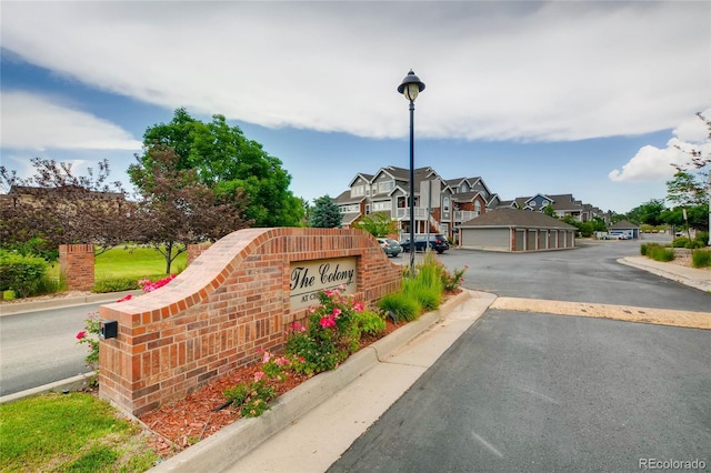 16320 E Fremont Ave Unit 1, Aurora, CO 80016 - view of asphalt road featuring curbs, a residential view, and street lights