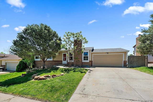 10832 W Powers Pl, Littleton, CO 80127 - ranch-style house featuring brick siding, an attached garage, driveway, and a chimney