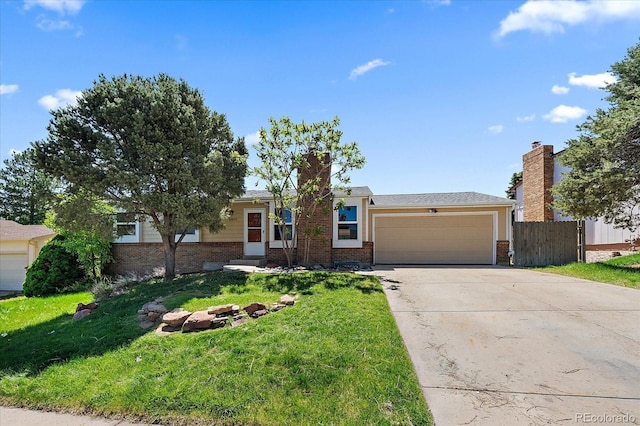 10832 W Powers Pl, Littleton, CO 80127 - view of front of house featuring brick siding, an attached garage, and concrete driveway