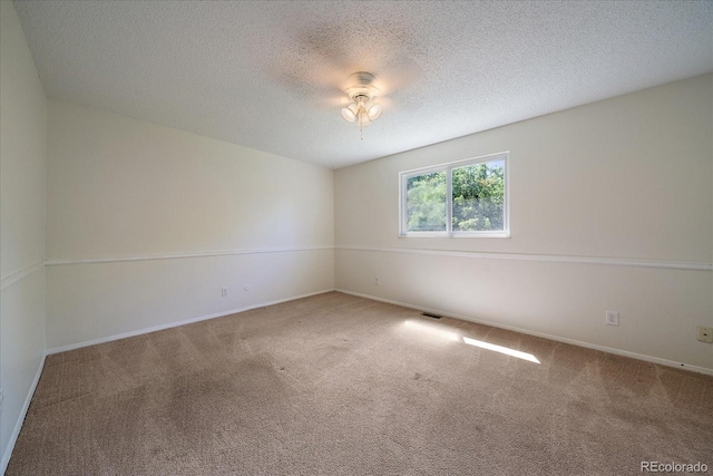10832 W Powers Pl, Littleton, CO 80127 - empty room featuring carpet floors, a textured ceiling, and baseboards