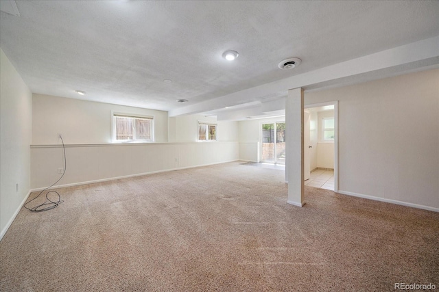 10832 W Powers Pl, Littleton, CO 80127 - basement featuring carpet floors, plenty of natural light, and baseboards