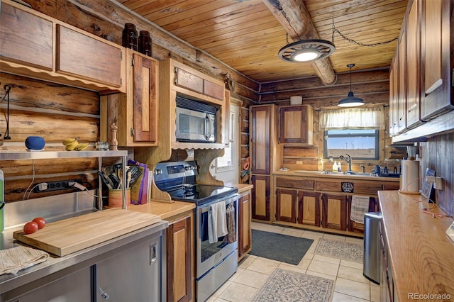 14475 N Yoder Rd, Calhan, CO 80808 - kitchen with stainless steel appliances, wooden ceiling, a sink, plenty of natural light, and brown cabinets