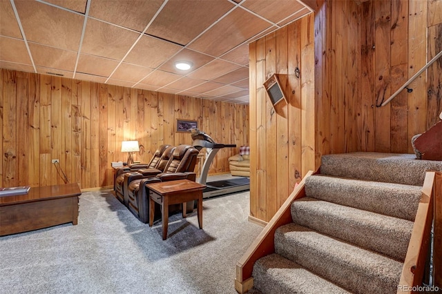 14475 N Yoder Rd, Calhan, CO 80808 - living area featuring stairway, carpet, and wooden walls