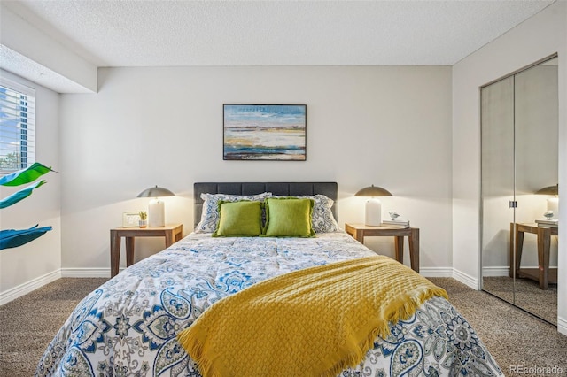 bedroom with a closet, baseboards, and carpet