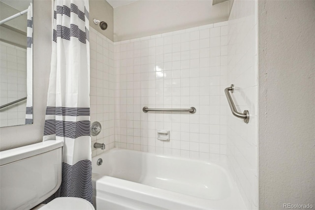 bathroom with toilet and shower / tub combo