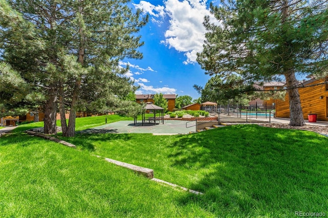 view of yard with a gazebo and fence