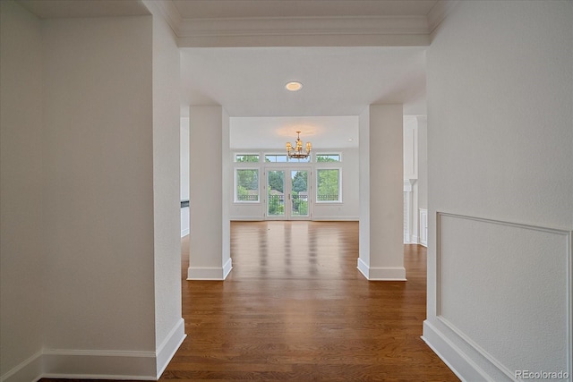 300 Hudson St Unit 203, Denver, CO 80220 - corridor with a chandelier, dark wood finished floors, and crown molding