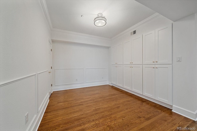 300 Hudson St Unit 203, Denver, CO 80220 - empty room featuring ornamental molding, wood finished floors, and a decorative wall