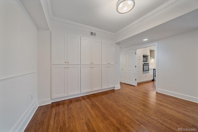 300 Hudson St Unit 203, Denver, CO 80220 - unfurnished room featuring wood finished floors and crown molding