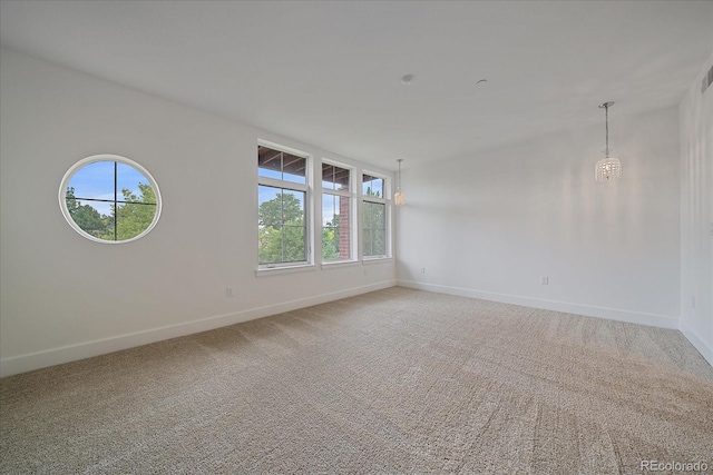 300 Hudson St Unit 203, Denver, CO 80220 - unfurnished room with baseboards and light colored carpet