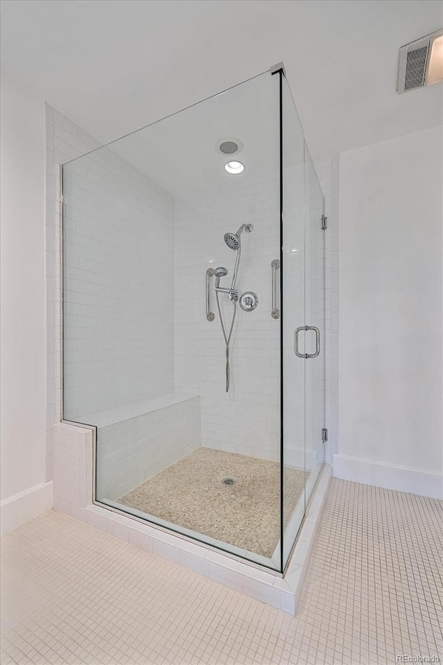 300 Hudson St Unit 203, Denver, CO 80220 - bathroom with tile patterned flooring and a shower stall