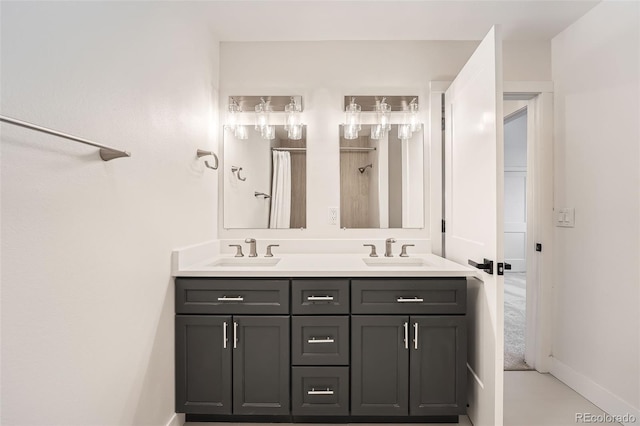 bathroom featuring double vanity, baseboards, and curtained shower