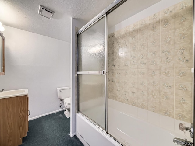 bathroom with toilet, bath / shower combo with glass door, a textured ceiling, vanity, and baseboards