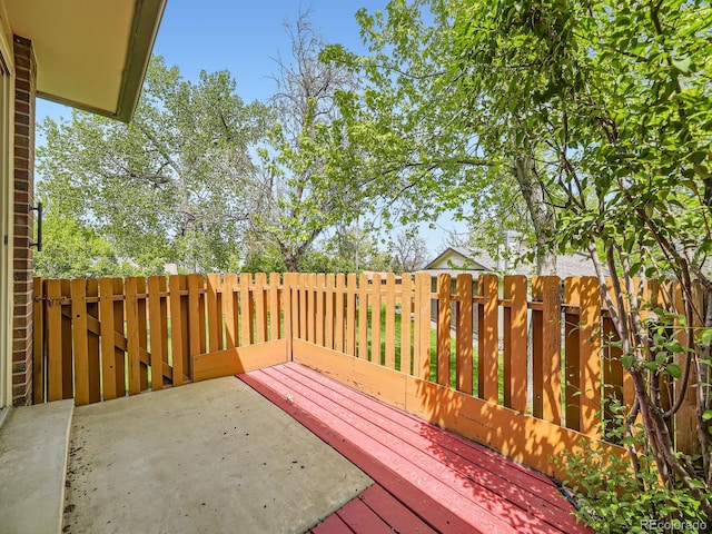 wooden terrace with a patio