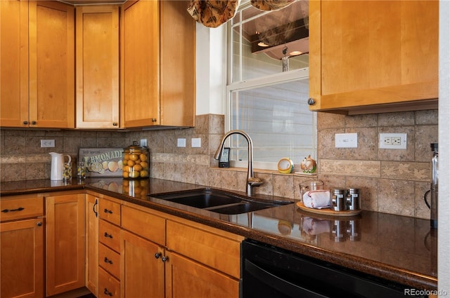 kitchen with a sink, dark countertops, backsplash, brown cabinets, and dishwasher