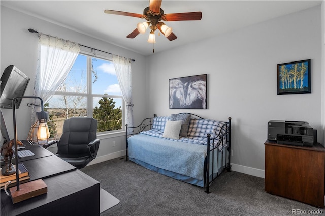 carpeted bedroom with a ceiling fan and baseboards