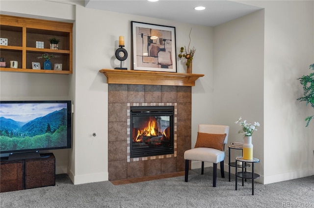 sitting room with recessed lighting, carpet floors, a tile fireplace, and baseboards