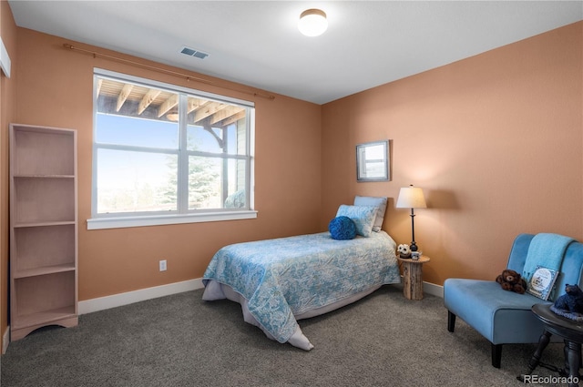 bedroom with baseboards, visible vents, and carpet floors