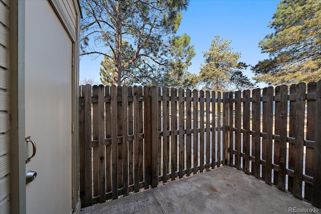 view of gate with fence