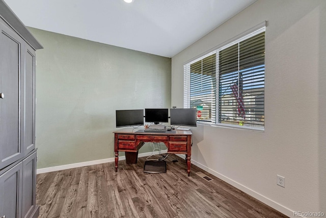 office area featuring baseboards and wood finished floors