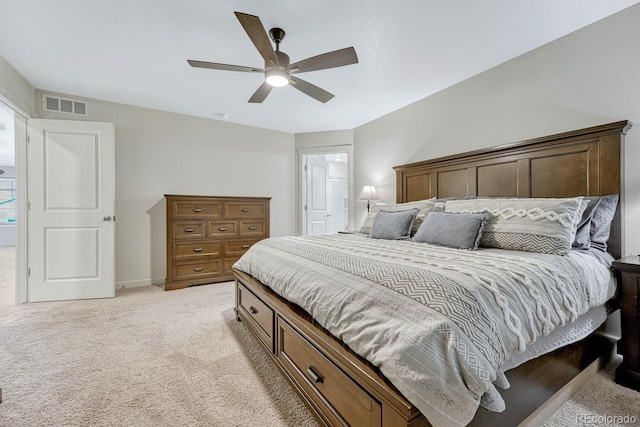 bedroom featuring visible vents, light colored carpet, baseboards, and ceiling fan