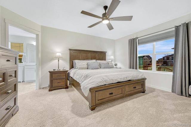 bedroom with ceiling fan and light carpet