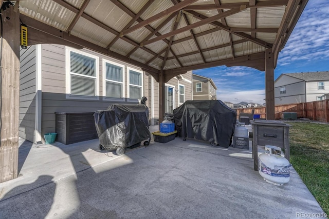 view of patio / terrace with a gazebo, area for grilling, and fence