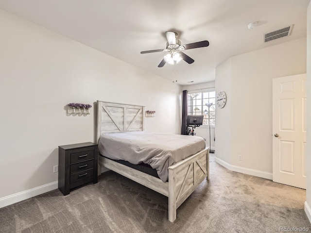 bedroom with visible vents, baseboards, carpet, and a ceiling fan