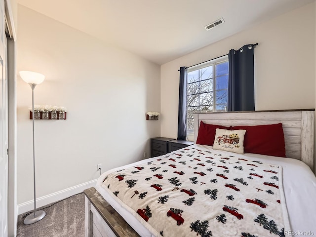 bedroom with visible vents, baseboards, and carpet flooring