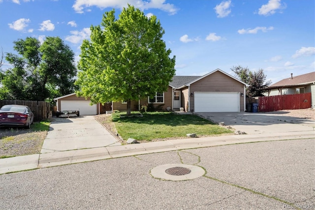 1115 Cherry Ct, Fort Lupton, CO 80621 - view of front facade featuring driveway and a garage