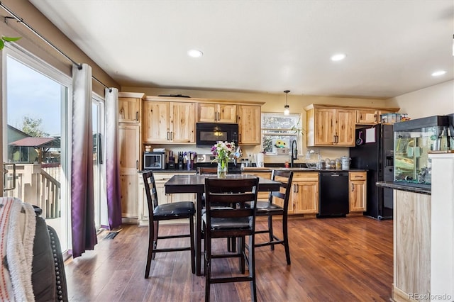 1115 Cherry Ct, Fort Lupton, CO 80621 - kitchen with black appliances, dark countertops, light brown cabinetry, recessed lighting, and dark wood-type flooring
