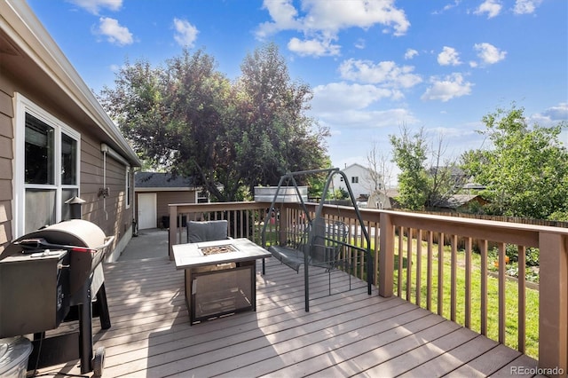 1115 Cherry Ct, Fort Lupton, CO 80621 - wooden deck featuring a fire pit and area for grilling