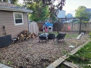 1115 Cherry Ct, Fort Lupton, CO 80621 - fenced backyard with a shed