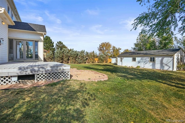 view of yard with a wooden deck