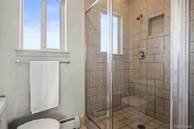 bathroom featuring a shower with door, a baseboard radiator, and toilet