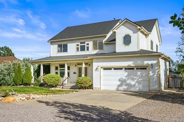 view of front facade with covered porch and a garage