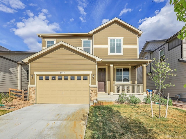 9844 Truckee St, Commerce City, CO 80022 - view of front facade with a porch, a front lawn, a garage, and concrete driveway