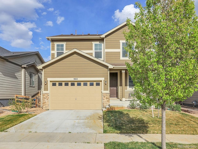 9844 Truckee St, Commerce City, CO 80022 - view of front of property with a garage, driveway, and a front yard