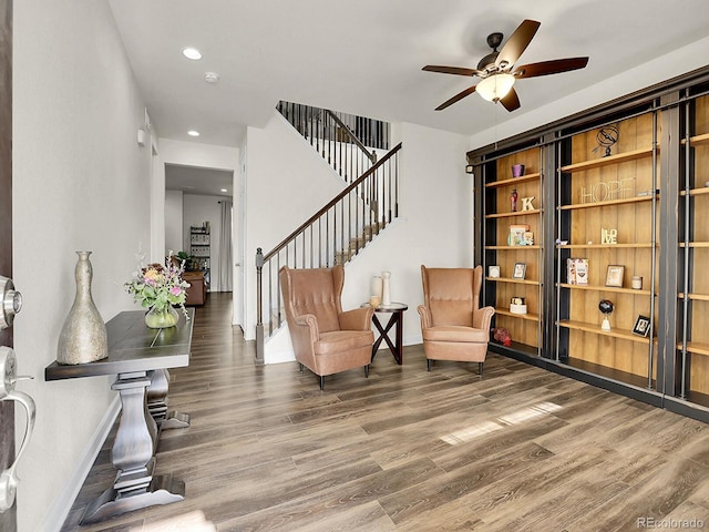 9844 Truckee St, Commerce City, CO 80022 - sitting room featuring baseboards, recessed lighting, wood finished floors, stairs, and ceiling fan