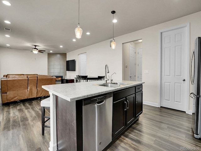 9844 Truckee St, Commerce City, CO 80022 - kitchen featuring stainless steel appliances, visible vents, a ceiling fan, a sink, and open floor plan