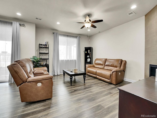 9844 Truckee St, Commerce City, CO 80022 - living room featuring recessed lighting, wood finished floors, visible vents, and a ceiling fan