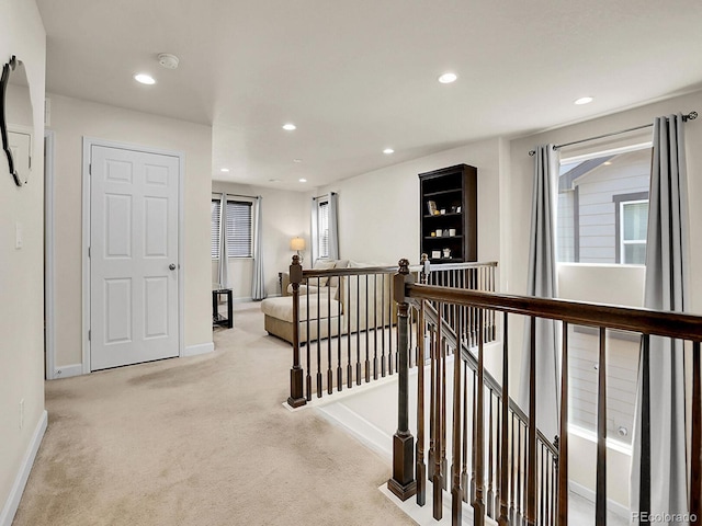 9844 Truckee St, Commerce City, CO 80022 - hall with recessed lighting, baseboards, light colored carpet, and an upstairs landing