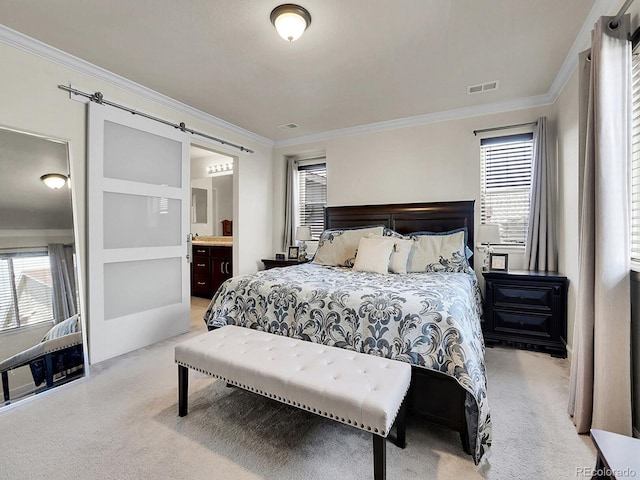 9844 Truckee St, Commerce City, CO 80022 - carpeted bedroom with a barn door, visible vents, and ornamental molding
