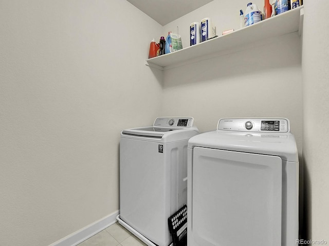9844 Truckee St, Commerce City, CO 80022 - laundry room featuring baseboards, independent washer and dryer, laundry area, and light tile patterned flooring