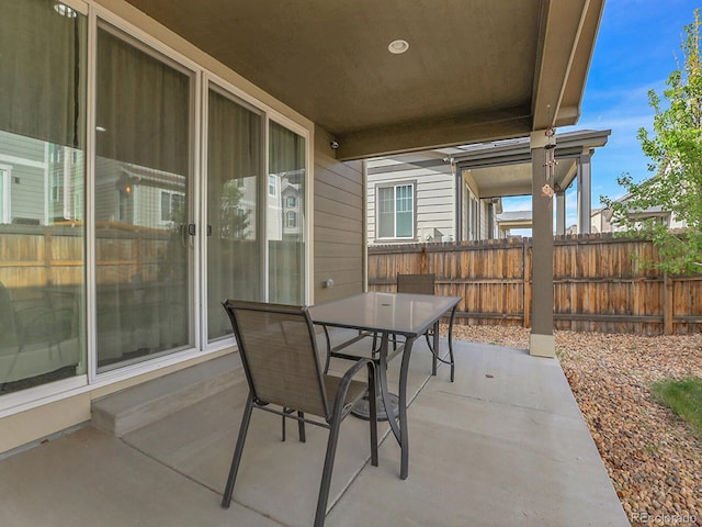 9844 Truckee St, Commerce City, CO 80022 - view of patio with outdoor dining area and fence